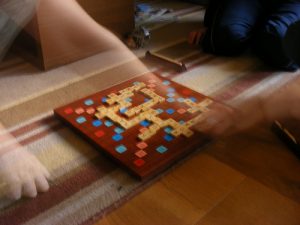 Family playing Scrabble